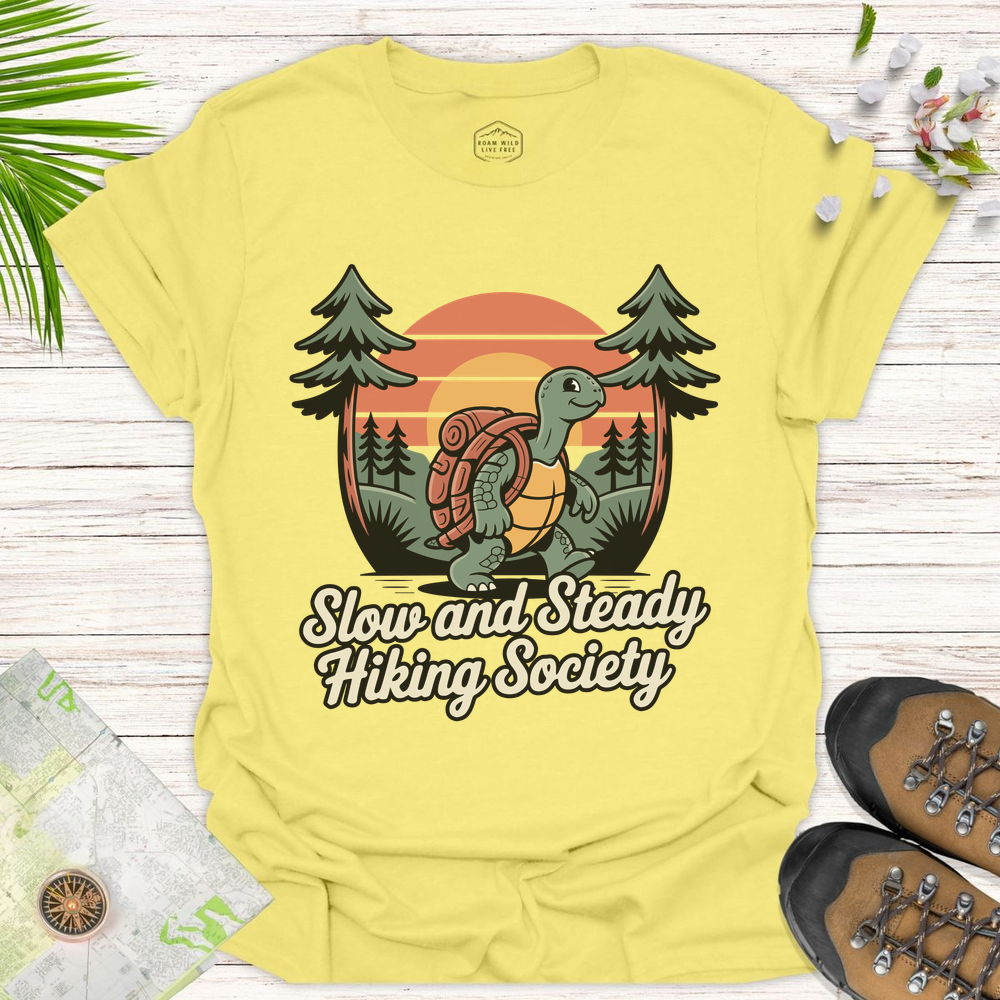 Tortoise Slow And Steady Hiking Society Unisex T-Shirt - Cornsilk